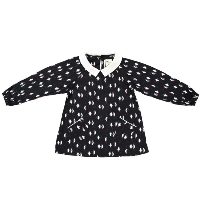 Fancy Christmas blouse for girl with long sleeves, black color with white and red penguin print, white Claudine collar. From the children's fashion brand LA FAUTE A VOLTAIRE