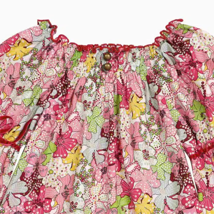 Blouse with smocked collar in red, yellow and green floral liberty cotton, puffed sleeves, smocked collar from the children's fashion brand LA FAUTE A VOLTAIRE
