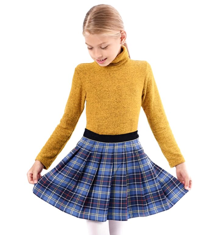 Pleated tartan skirt with royal blue tartan and yellow and red threads for little girls and teens from 2 to 14 years old. Black velvet belt and contrasting bias under the gold belt. Side opening with snap and zipper. French designer brand LA FAUTE A VOLTAIRE