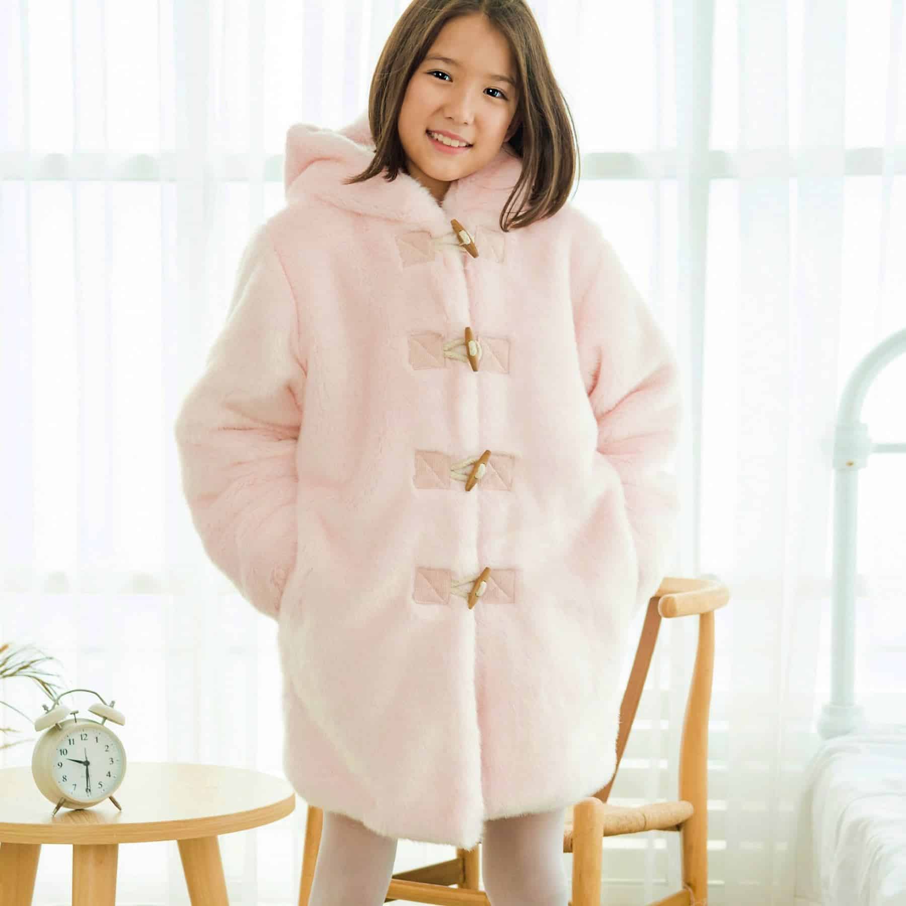 Candy pink faux fur duffle coat with wooden button from the children's fashion brand LA FAUTE A VOLTAIRE