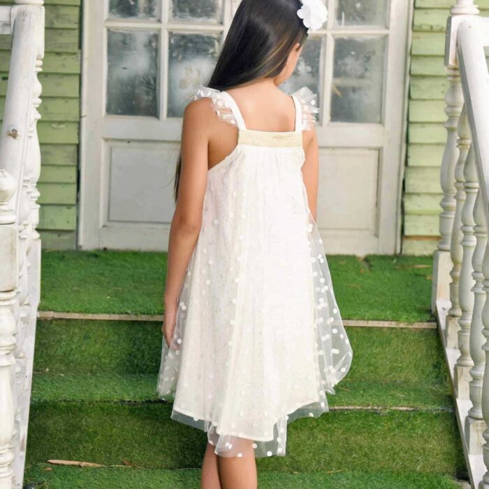 Bohemian off-white veil formal dress with square gold sequin collar, ruffled straps, cotton lining. Model Alizée from the children's fashion brand LA FAUTE A VOLTAIRE