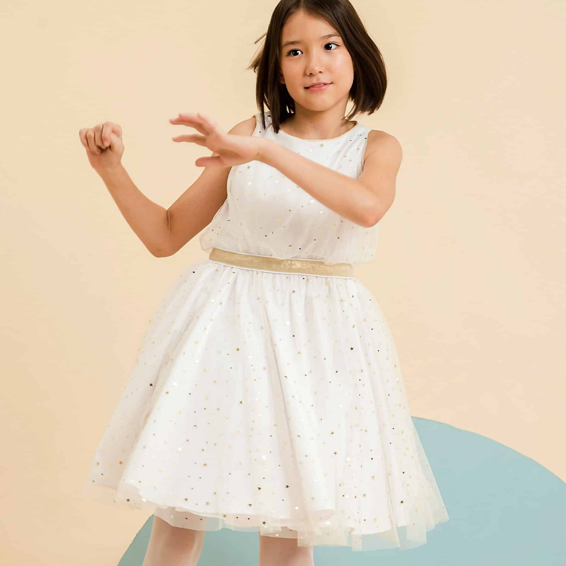 White cotton and tulle evening dress with golden stars from the children's fashion brand La Faute à Voltaire