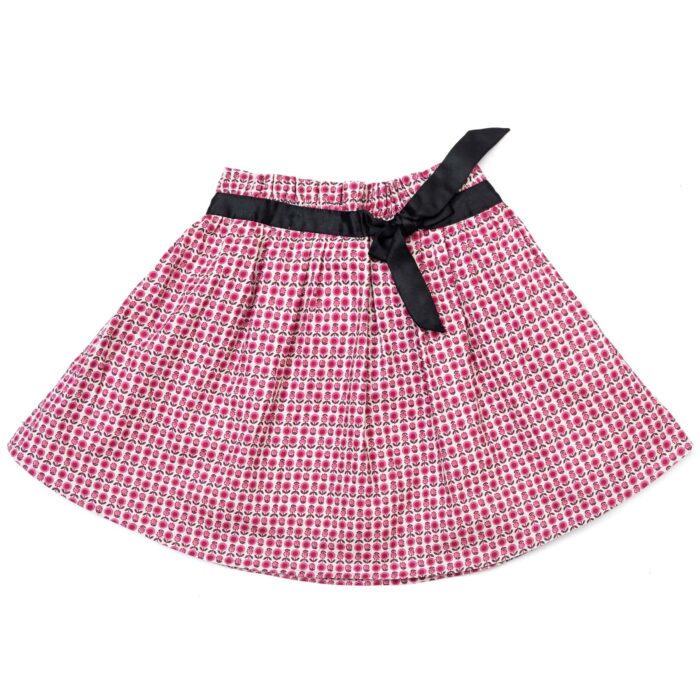 jupe fleurie en coton rose avec taille élastique en satin noir. Pour les petites filles de 2 à 12 ans. Marque Française pour enfant LA FAUTE A VOLTAIRE