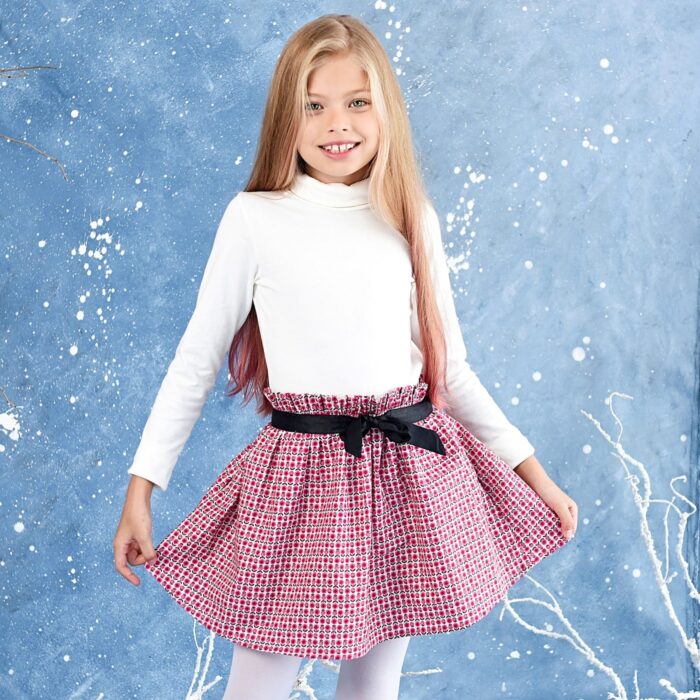 pretty pink floral skirt for girls with elastic waist and black satin ribbon. Chic and comfortable skirt for girls from the children's fashion brand la faute a voltaire