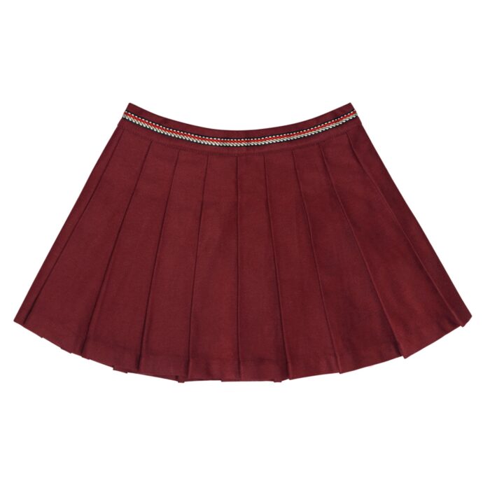 Une élégante jupe plissée en coton gabardine couleur bordeaux prune pour fille et fillette de 2 à 12 ans de la marque de mode pour enfant Française LA FAUTE A VOLTAIRE