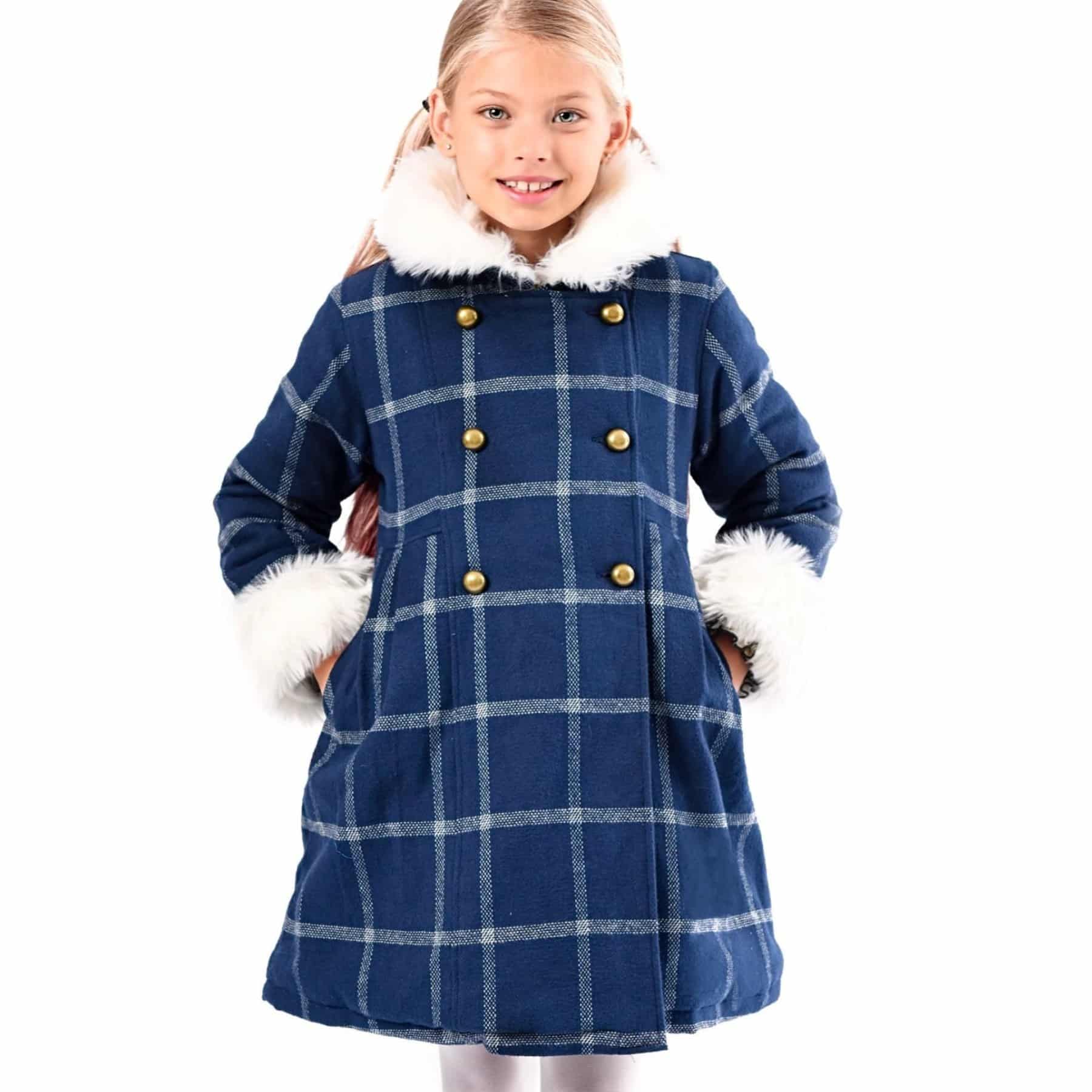 Navy blue wool coat with large white checks and white faux fur collar for girls from the children's fashion brand LA FAUTE A VOLTAIRE