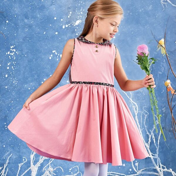 Dress that turns sleeveless in pale pink velvet and collar Claudine flowered liberty black and pink of the brand creator for children THE FAULT A VOLTAIRE