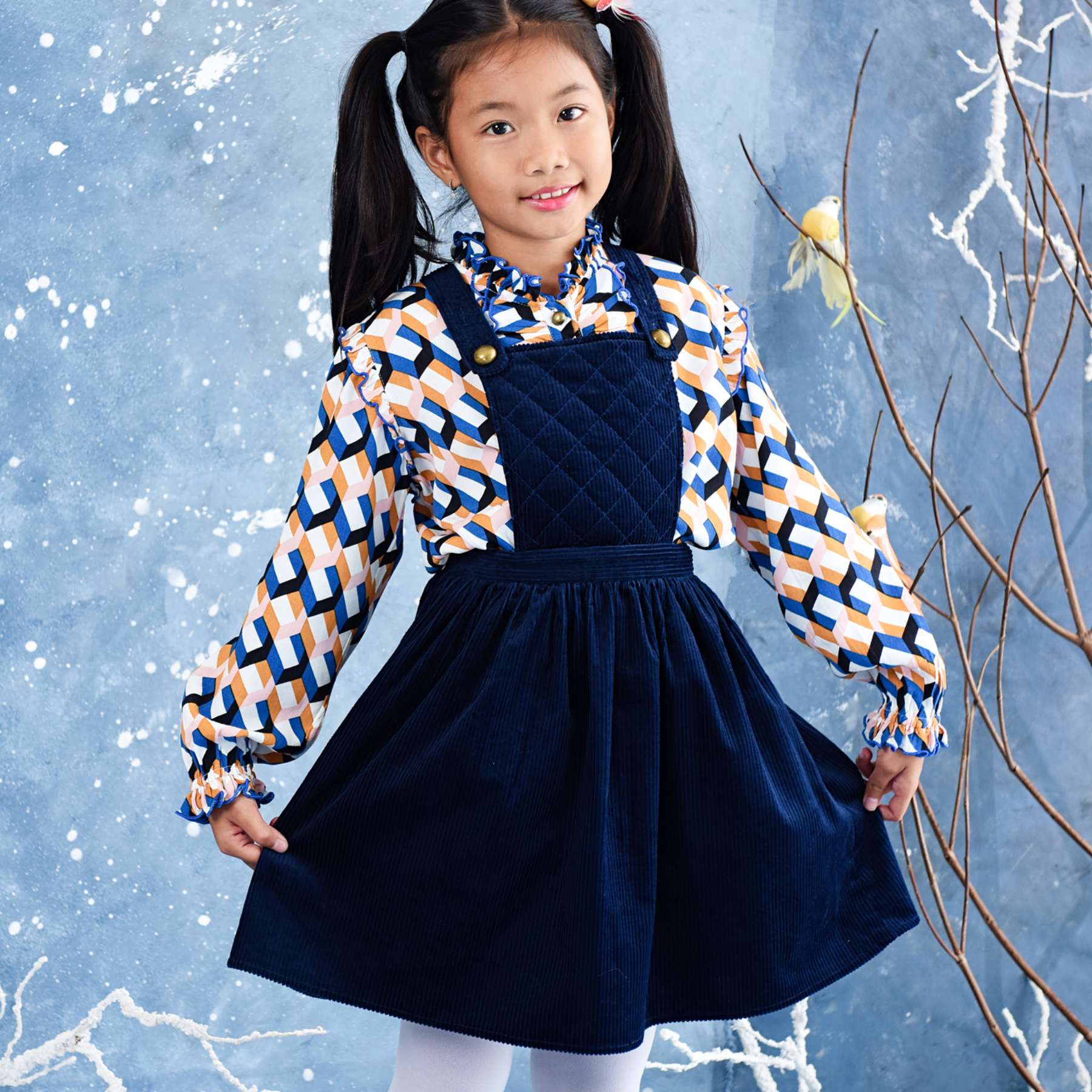 navy blue velvet apron dress for girls and young women from the children's fashion brand la faute a voltaire