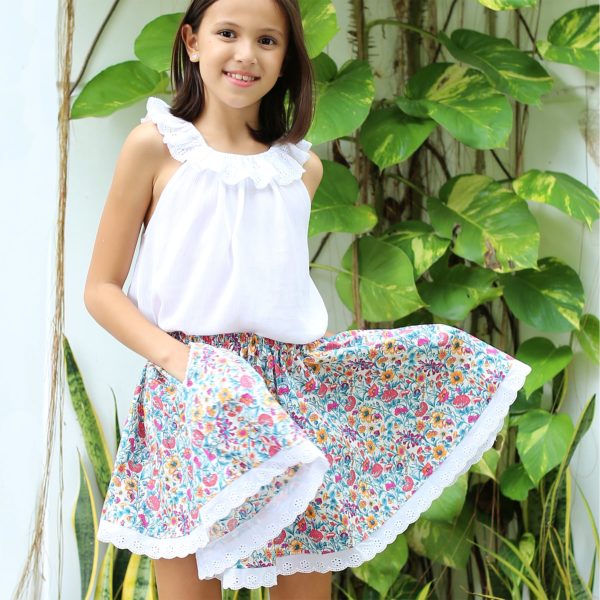 Skirt which turns in flowery cotton liberty and white English embroidery for little girls from 2 to 14 years old