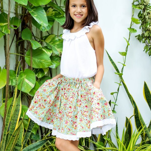 Mid-length summer skirt for girls 2 to 14 years old in green liberty floral cotton with elastic waist and white broderie anglaise trim