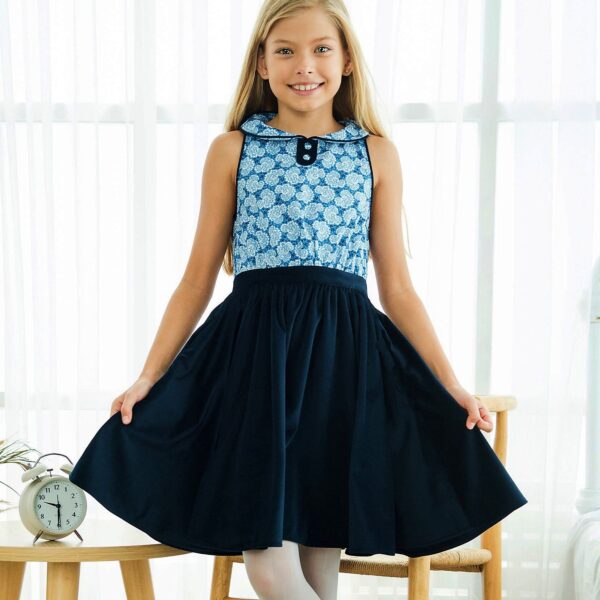 Dress that turns bi-material in liberty cotton flowered king blue on the bust and velvet milleraies on the skirt, sleeveless, flowery Claudine collar lined with navy blue velvet. Design of the fashion brand for children retro chic in fair trade LA FAUTE A VOLTAIRE