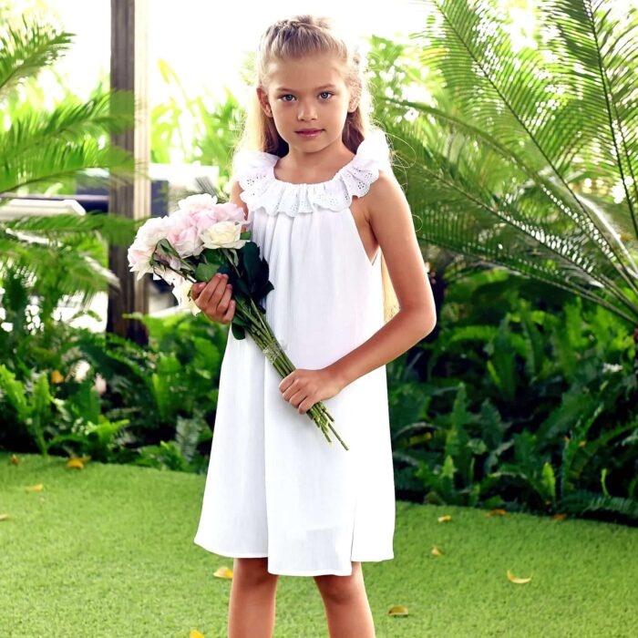 White communion dress with elastic collar in white broderie anglaise from the children's fashion brand LA FAUTE A VOLTAIRE