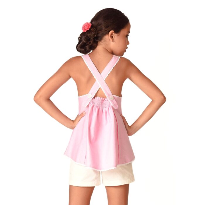 Pastel pink pastel blouse with crossed straps for little girls from the children's fashion brand LA FAUTE A VOLTAIRE