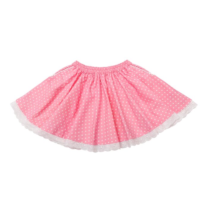 Pretty pink skirt with white polka dots summer fashion for girl with elastic waist, pockets and bottom of the skirt in white lace. Skirt of the fashion brand for children and teenagers from 2 to 16 years old LA FAUTE A VOLTAIRE