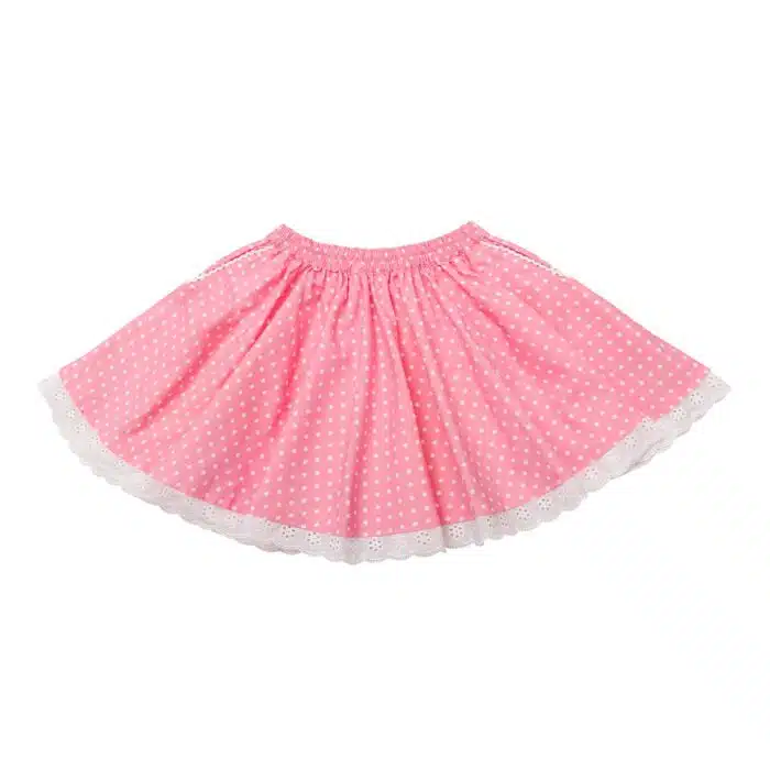 Jolie jupe rose à pois blanc mode été pour fille avec taille élastique, poches et bas de la jupe en dentelle blanche. Jupe de la marque de mode pour enfants et ados de 2 à 16 ans LA FAUTE A VOLTAIRE