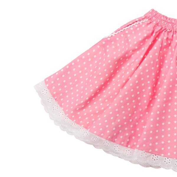 Jolie jupe rose à pois blanc mode été pour fille avec taille élastique, poches et bas de la jupe en dentelle blanche. Jupe de la marque de mode pour enfants et ados de 2 à 16 ans LA FAUTE A VOLTAIRE