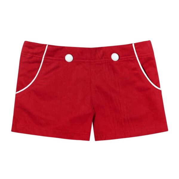 Short d'été pour petites filles en coton rouge et gros boutons et biais blancs décoratif sur les poches. Short de la marque de mode pour enfants LA FAUTE A VOLTAIRE
