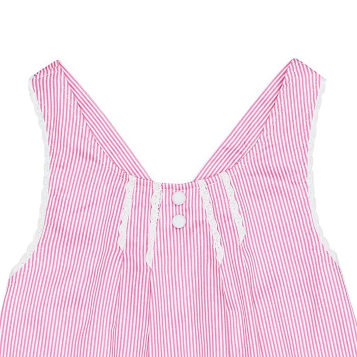 Girl's summer blouse in satin cotton with fine dark pink and white stripes, crossed straps edged with fine white lace from the children's fashion brand LA FAUTE A VOLTAIRE