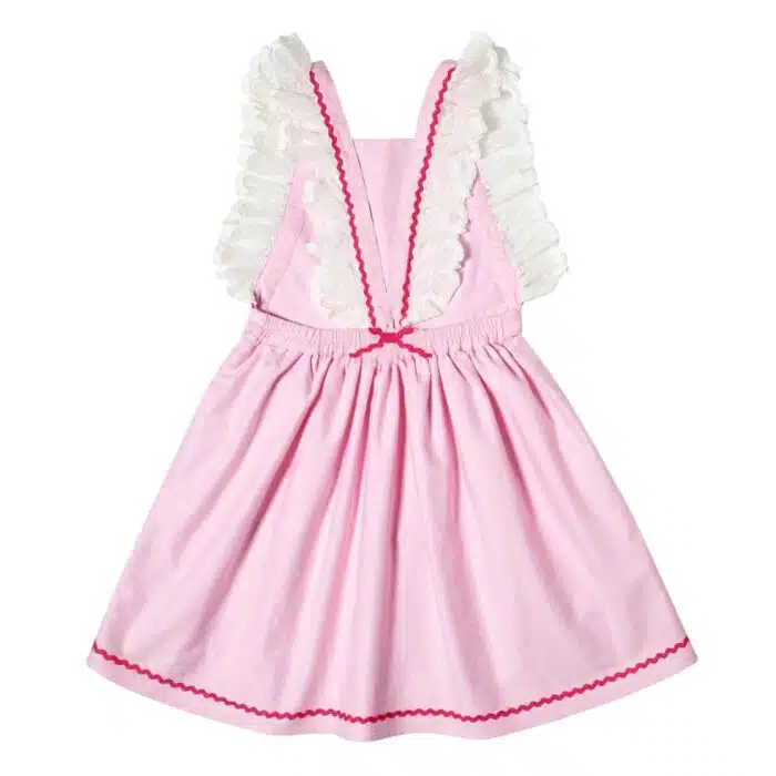 Robe bohème rose pâle à bretelles en fine dentelle beige, dos nu, taille élastique, détaille rose fuchsia de la marque de. mode pour enfants LA FAUTE A VOLTAIRE
