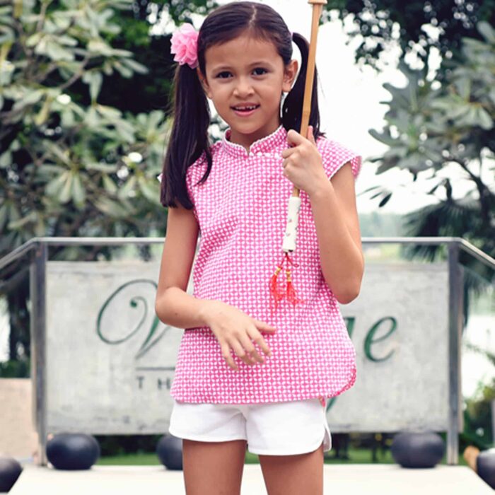 Fuchsia pink and white cotton graphic blouse with Mao collar and short sleeves trimmed with pompoms for girls 2 to 14 years old