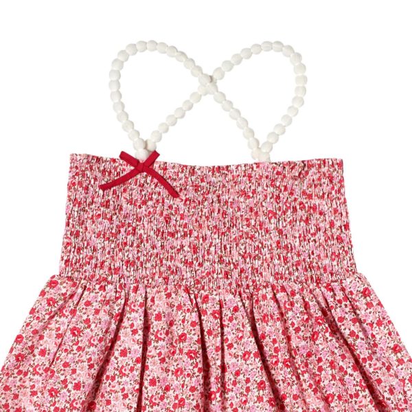 Haut été en coton fleuri liberty rose avec poitrine à smocks et bretelles en pompons blancs pour filles de 2 à 12 ans