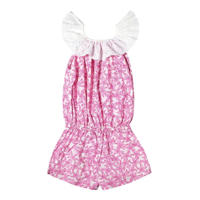 Cute fuchsia pink and white starfish combishort for girls from 2 to 12 years old with a white embroidery anglaise collar and pockets lined with white pompons from the children's fashion brand LA FAUTE A VOLTAIRE