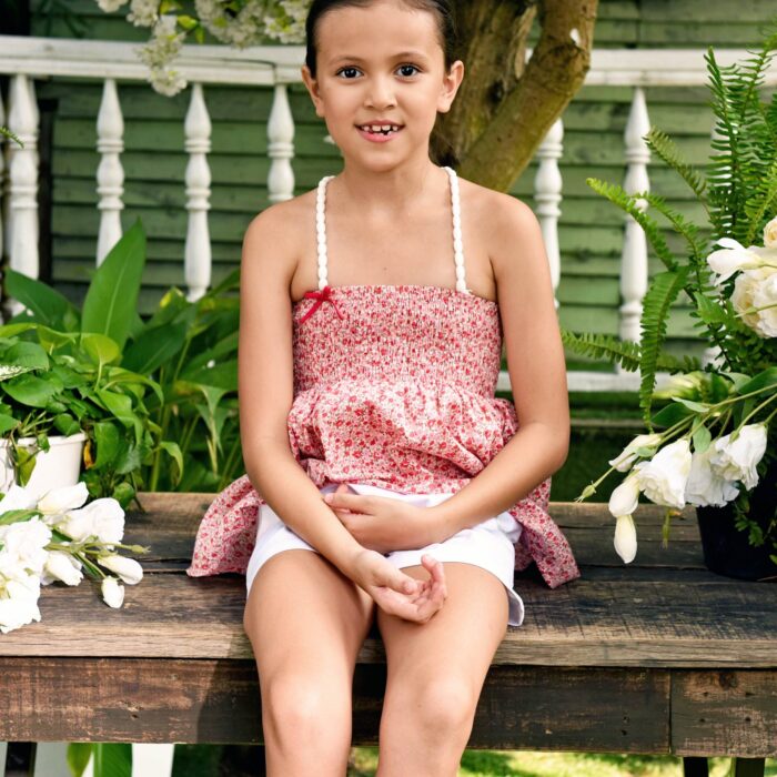 Jolie blouse en coton liberty rose, à col smocks, bretelles élastiques blanches. LA FAUTE A VOLTAIRE est une marque de mode pour enfants et ados de 2 à 16 ans