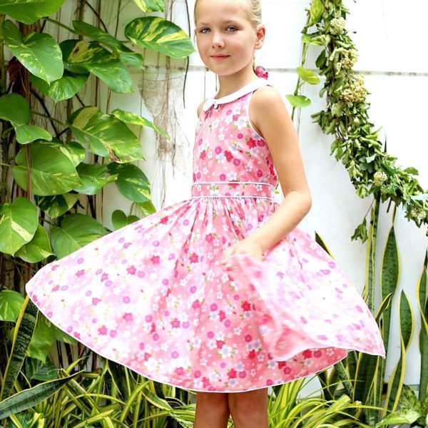 dress which turns of ceremonies for girl liberty pink flowered with small pointed Claudine collar in white satin cotton of the brand of fashion for children in retro trade chic and equitable LA FAUTE A VOLTAIRE
