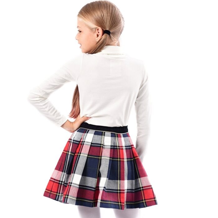 jupe écossaise en laine carreaux tartan bleu marine rouge pour filles et ados de 2 à 16 ans, avec ceinture intégrée en velours noir et biais doré contrasté. Fermeture sur le côté avec bouton pression et fermeture éclair. Marque créateur française de LA FAUTE A VOLTAIRE