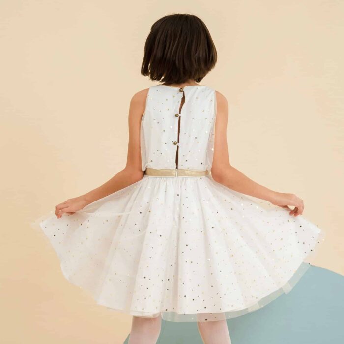 evening dress and new year's eve turning in white tulle and golden star sequins, integrated belt in golden linen, zipper in the back to the waist and round button bronze color in the back, cotton lining. Children's fashion brand in fair trade LA FAUTE A VOLTAIRE