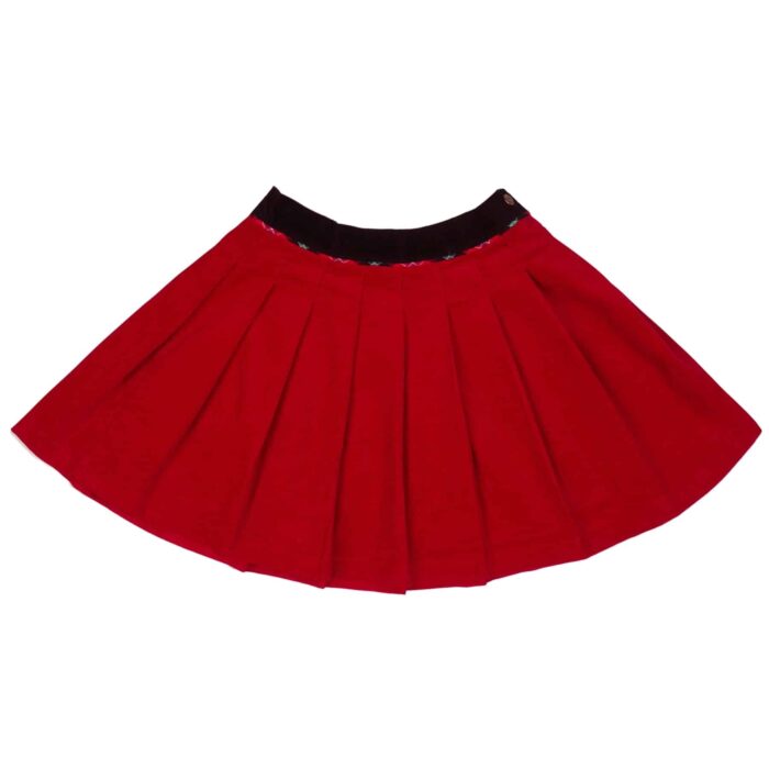 Jupe hiver courte plissée pour fille en velours rouge et ceinture tartan vert de la marque créateur française LA FAUTE A VOLTAIRE