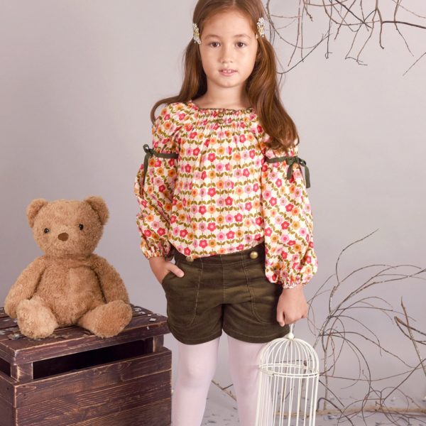 Winter shorts for little girl in khaki green corduroy and big round buttons from the children's fashion brand LA FAUTE A VOLTAIRE