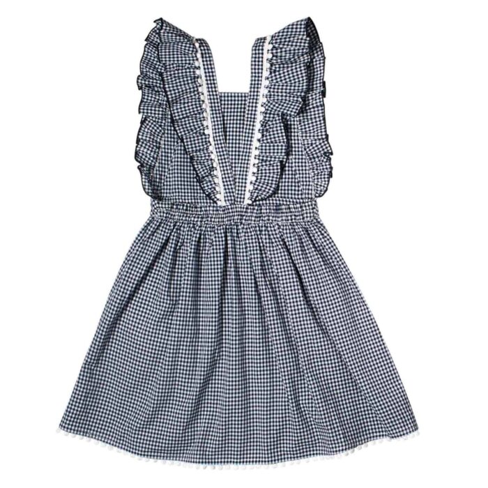 Cute black and white gingham apron dress for girls with ruffled straps from the children's fashion brand LA FAUTE A VOLTAIRE