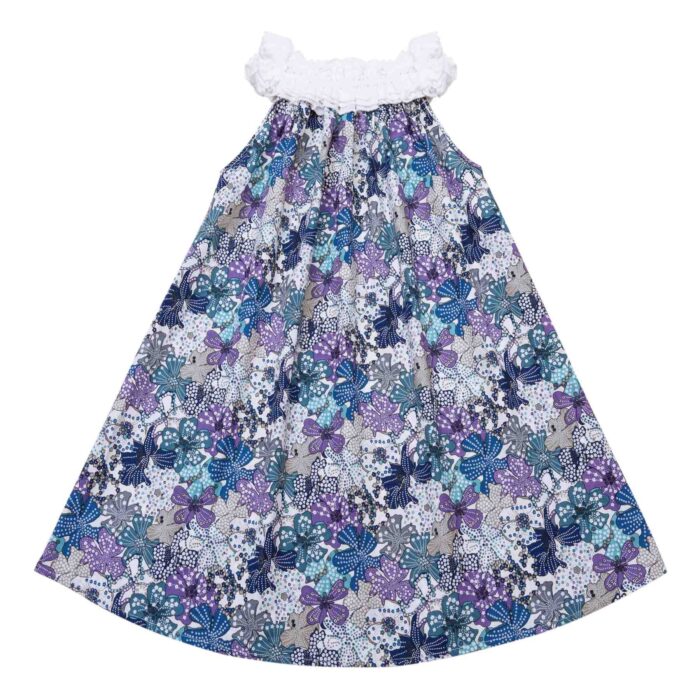 Pretty summer dress in blue, purple and lilac liberty floral cotton with white frilly elastic collar. Summer dress model of the fashion brand for children LA FAUTE A VOLTAIRE
