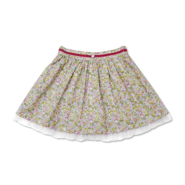 Pretty summer skirt in green liberty floral cotton, with white tulle, and a pink velvet belt for girls. Skirt of the fashion brand for children and teenagers LA FAUTE A VOLTAIRE.
