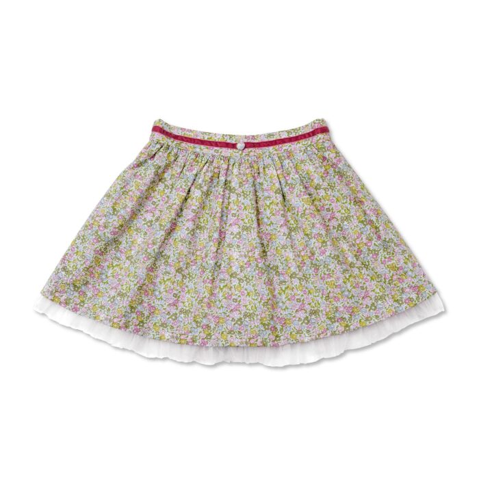 Jolie jupe été en coton fleuri liberty vert, avec de la tulle blanche, et une ceinture en velours rose pour filles. Jupe de la marque de mode pour enfants et ados LA FAUTE A VOLTAIRE.