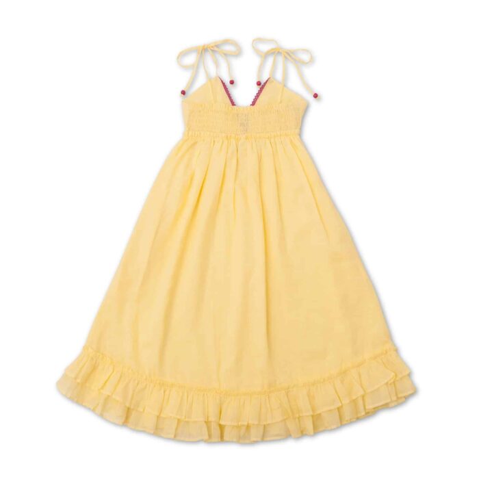 Jolie robe qui tourne en coton jaune, avec des fines bretelles, de la dentelle rose et des volants. Robe de la marque de mode pour enfants et ados LA FAUTE A VOLTAIRE.