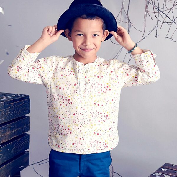 Pretty off-season shirt in white cotton with yellow and red stars for boys. Shirt of the fashion brand for children and teenagers LA FAUTE A VOLTAIRE.