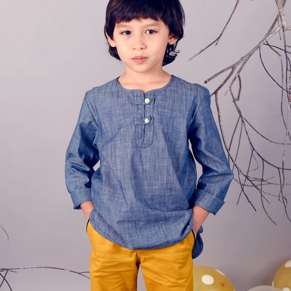 Nice cotton shirt blue denim color for boy. Shirt from the fashion brand for children and teenagers LA FAUTE A VOLTAIRE
