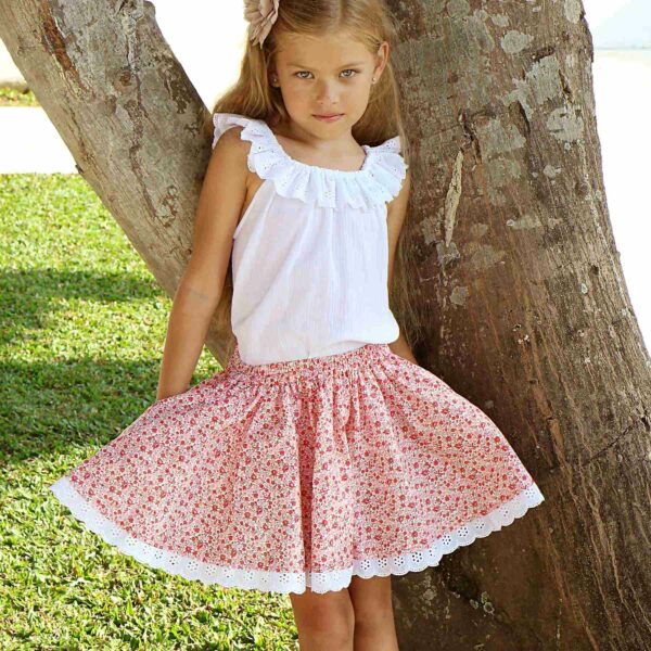 Pretty summer skirt in pink flowered cotton, and embroidery anglaise for girl. Skirt of the fashion brand for children and teenagers LA FAUTE A VOLTAIRE.