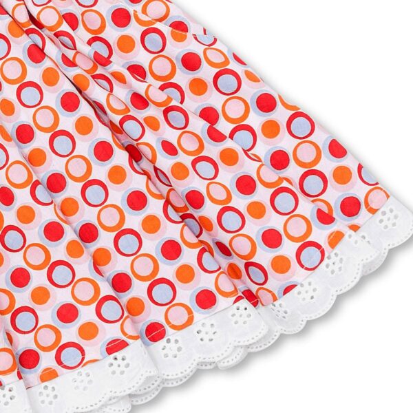 Pretty summer skirt in cotton red color and round patterns in pink and orange tones for girls. Skirt of the fashion brand for children and teenagers LA FAUTE A VOLTAIRE.