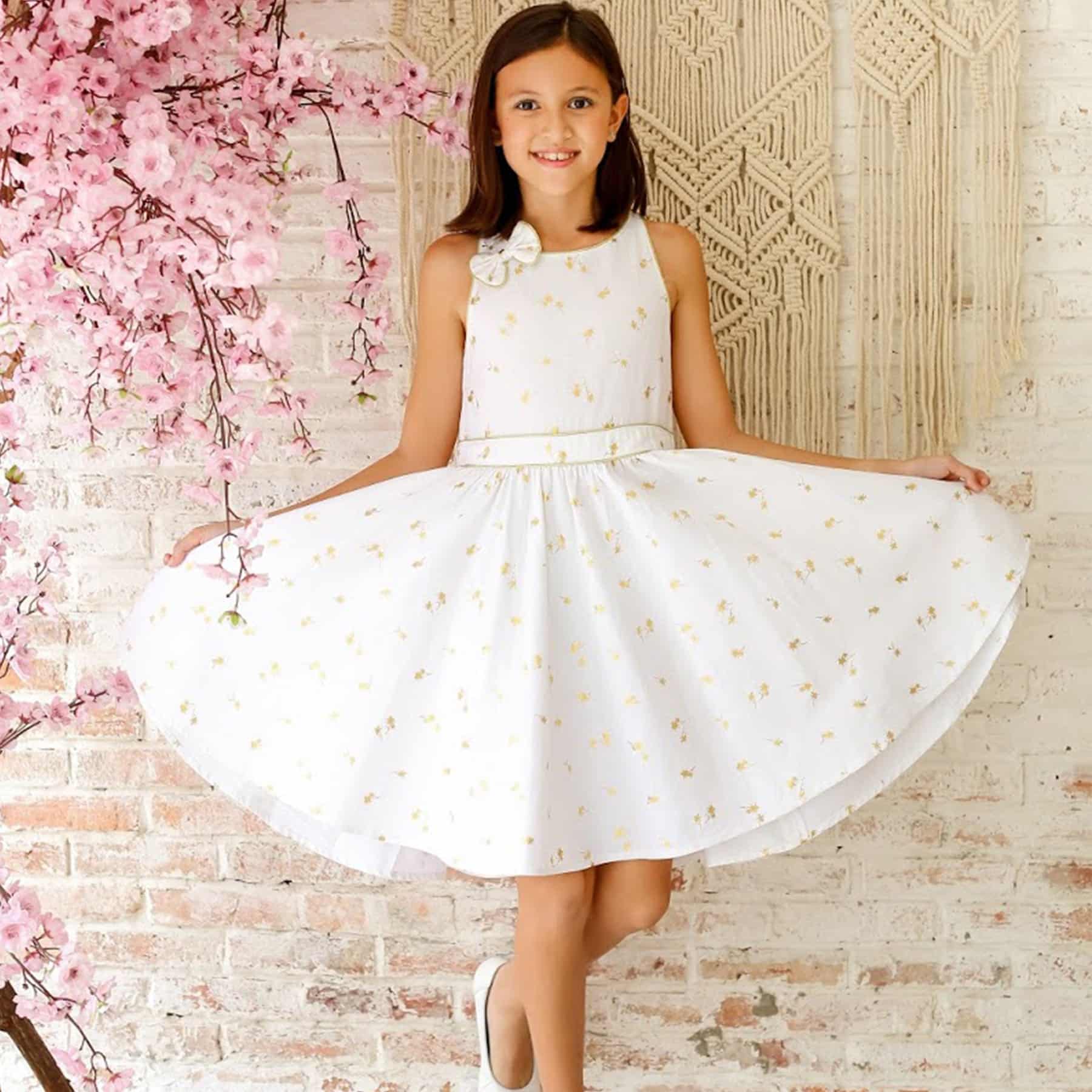 Beautiful dress. which turns ceremonial in white linen. with golden trees. Wedding dress model for wedding, communion of the fashion brand for children La Faute à Voltaire