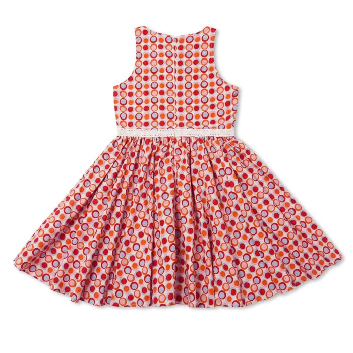 Cute summer dress in cotton with red, pink and blue circles for girls. Dress model HEPBURN of the fashion brand for children and teenagers LA FAUTE A VOLTAIRE.