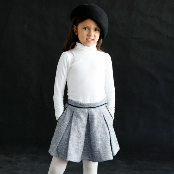 Pretty skirt for girls winter in blue tweed, pockets lined with navy blue velvet borders. LOLA skirt model from the fashion brand for children and teenagers LA FAUTE A VOLTAIRE.
