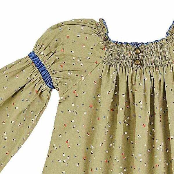 Pretty flowery khaki color cotton dress for girls. The dress can be worn several years in a row because it turns into a tunic. With its balloon sleeves, its smocked collar and its two pretty round bronze buttons, this tunic dress is very trendy. Dress model CHIMENE of the fashion brand for children and teenagers LA FAUTE A VOLTAIRE.