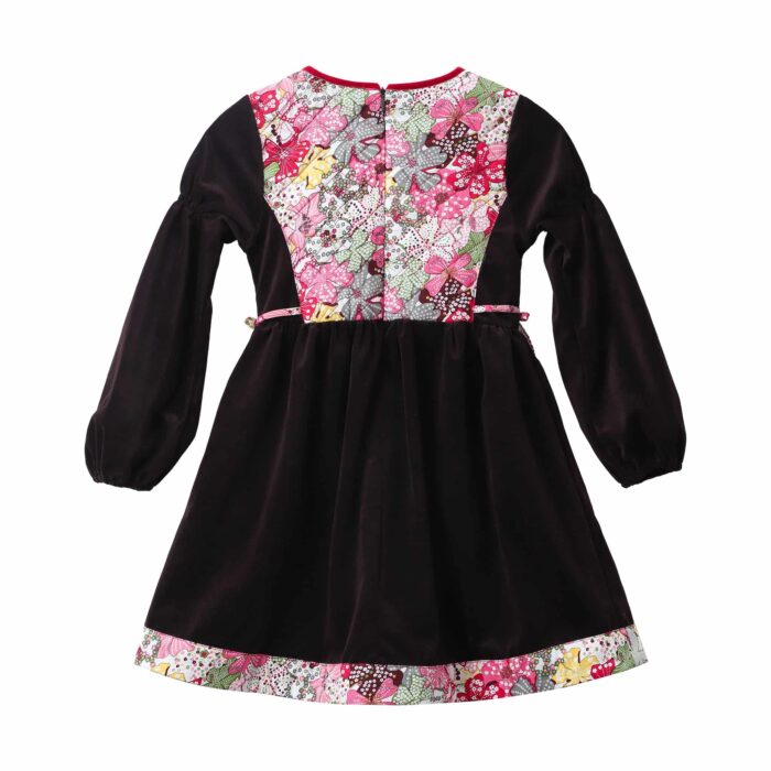 Cute winter dress for little one in brown corduroy and quilted front panel in pink and red liberty floral cotton, long balloon sleeves. Model of the fashion brand for children and teenagers LA FAUTE A VOLTAIRE