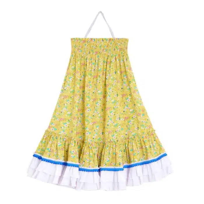 Jolie robe longue deux en un pour filles, ados et femmes à col smocks qui se transforme en jupe longue, volants blanc en bas de la robe bordés de petits pompons bleu roi de la marque de mode vêtements pour enfants LA FAUTE A VOLTAIRE