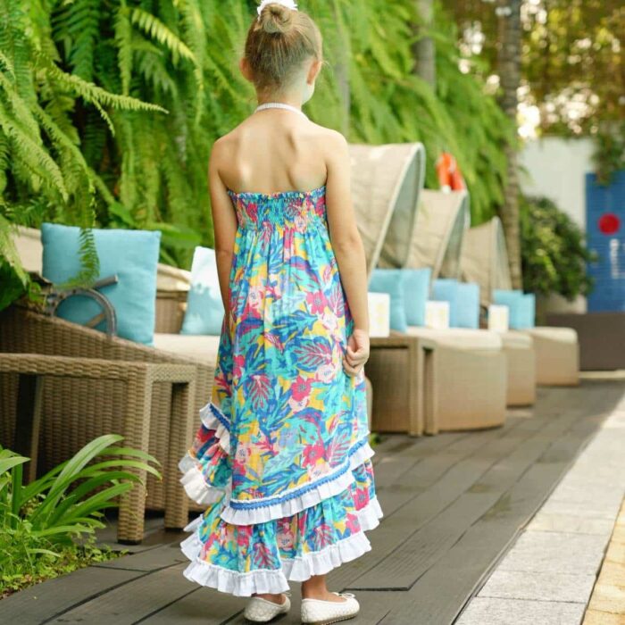 Robe longue de plage deux en un pour fille à fleurs hawaii couleur bleu vert, rose et jaune, col smocks, qui se porte en jupe longue de la marque de mode pour enfant LA FAUTE A VOLTAIRE