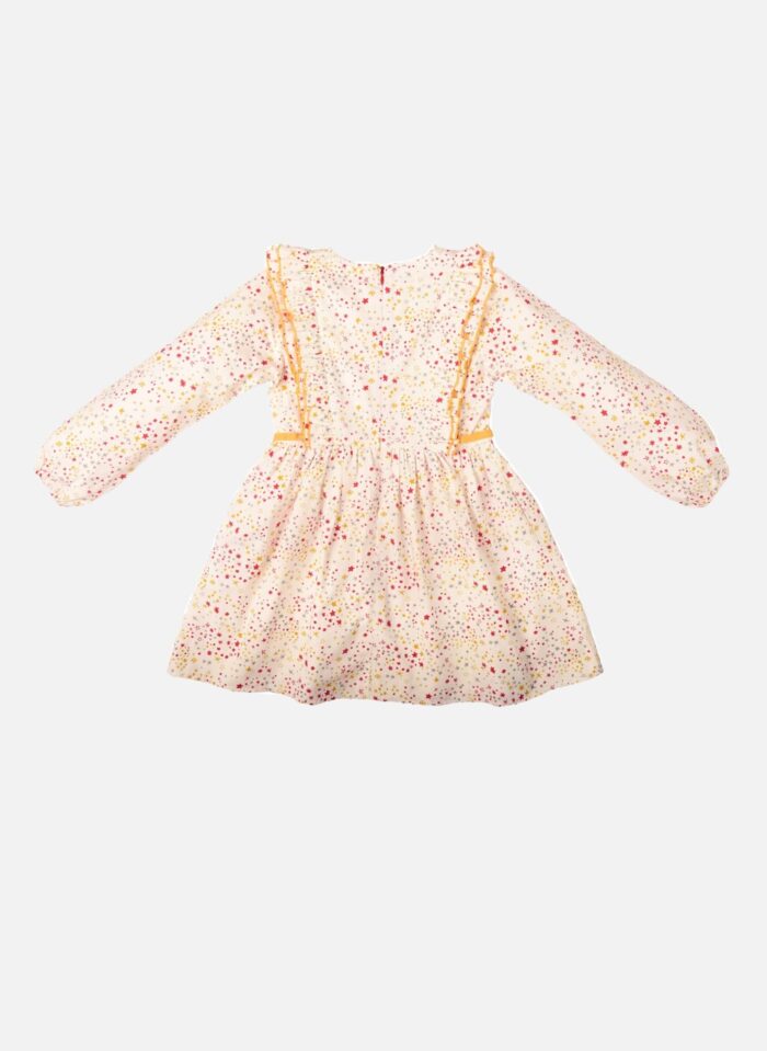 Une Adorable Robe Hiver à Manches Longues et Emmanchures à Volants en Coton Blanc et Étoiles Rouge et Jaune pour Fille de la Marque de mode pour Enfant La Faute à Voltaire.