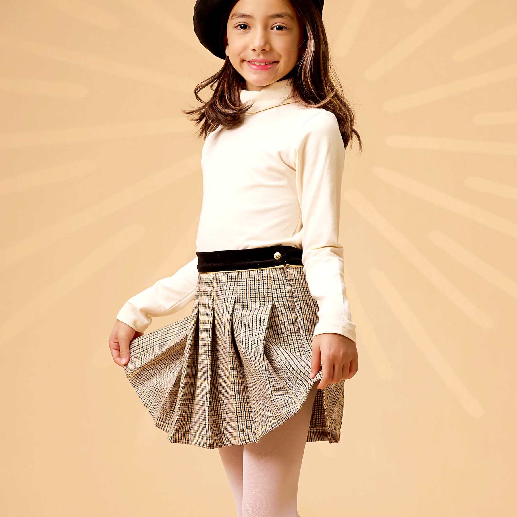 Une Superbe Jupe Plissée en Laine Mélangée Tweed à Carreaux Marron, Beige, Jaune et Noir et Ceinture Contrastée en Velours Noir avec biais Doré très Chic pour Filles, Fillettes et Ados de 2 à 16 ans de la Marque de Mode Française Chic pour Enfant La Faute à Voltaire